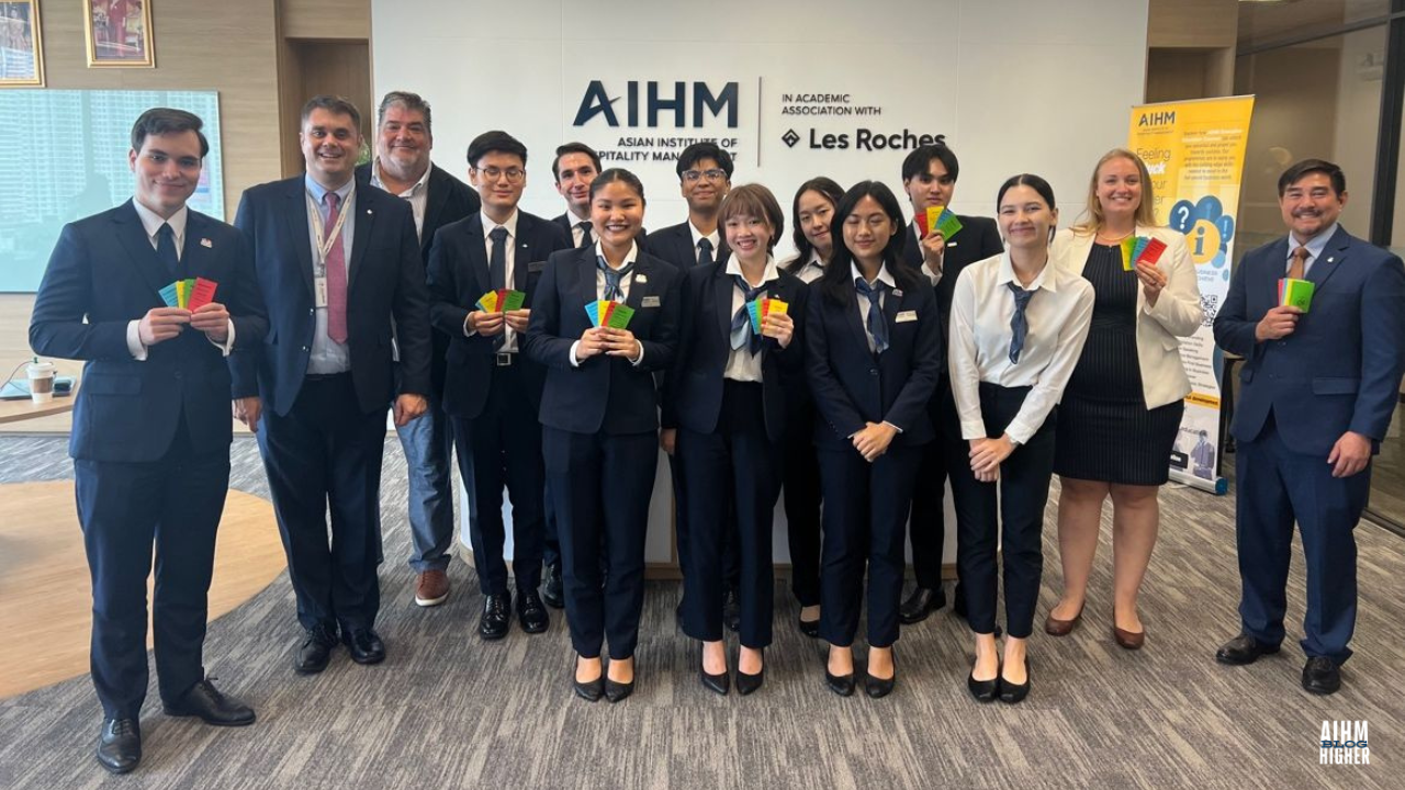 AIHM BBA hospitality student took a photo with the guest speaker after the class