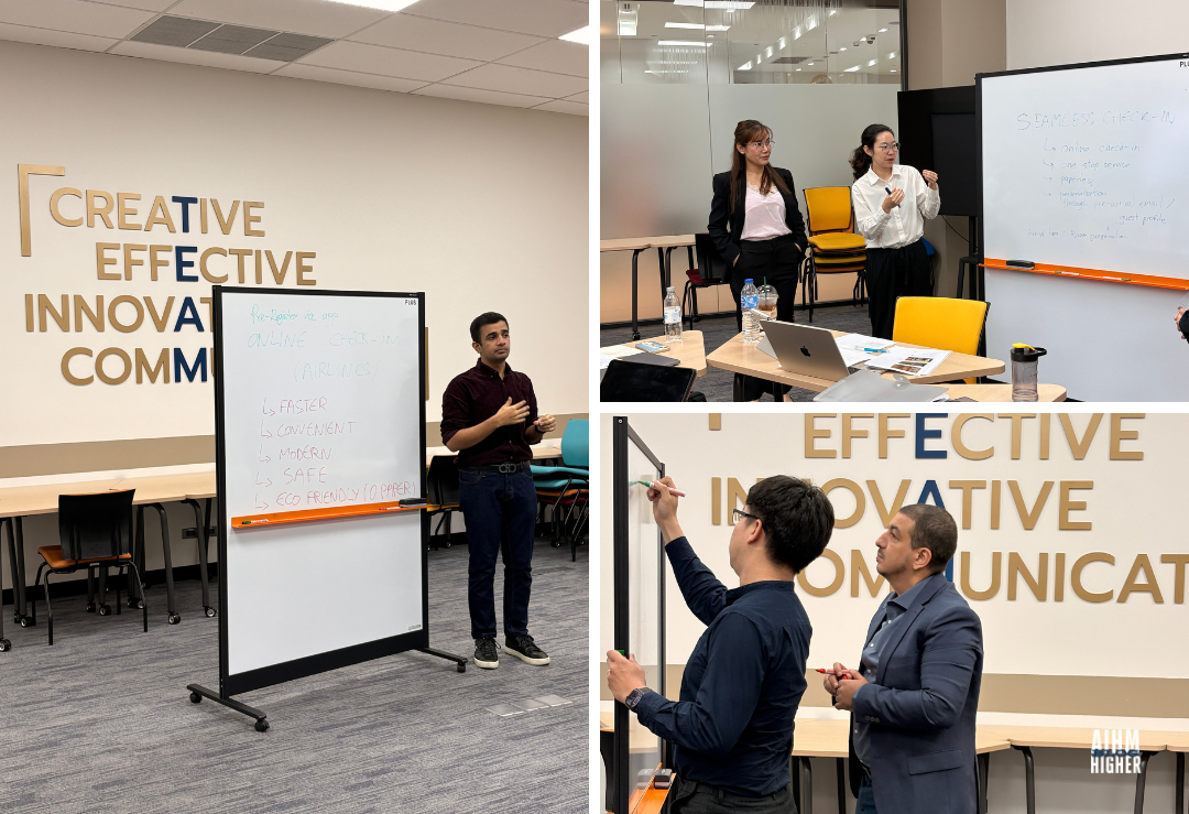 AIHM PGD students presenting business ideas during Entrepreneurship and Business Modelling class, discussing innovation and creative hospitality solutions in a modern learning space at the Asian Institute of Hospitality Management.