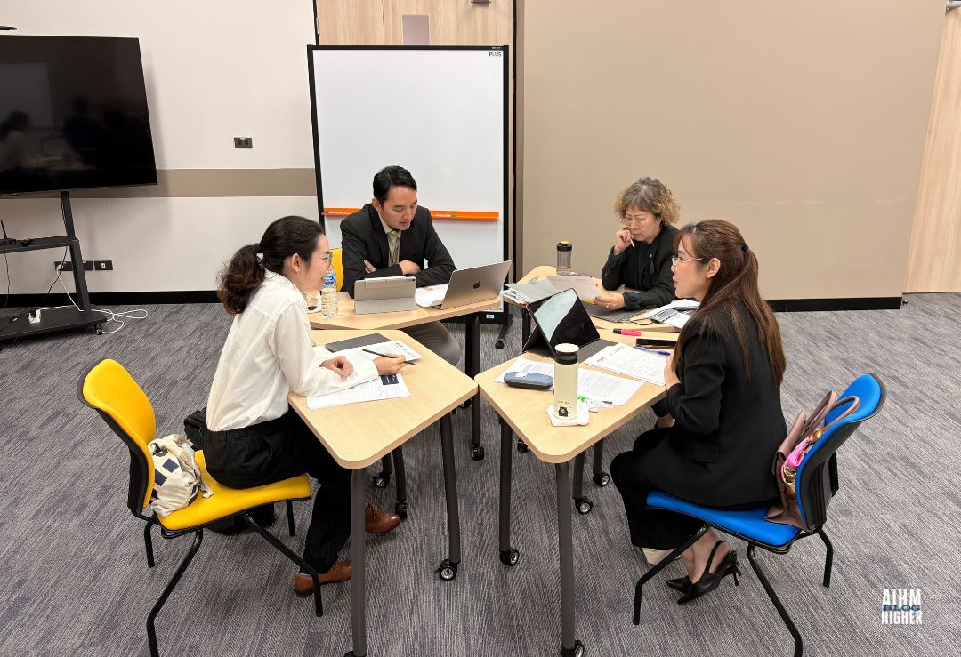 AIHM PGD students collaborating in small groups to develop business models and entrepreneurship strategies in hospitality management, guided by professional lecturers at the Asian Institute of Hospitality Management.