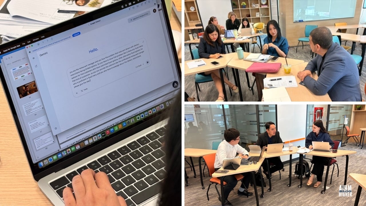 AIHM postgraduate students studying Entrepreneurship and Business Modelling, using AI prompts to enhance learning and business creativity in a modern classroom.